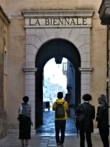 An archway in Venice reads La Biennale, marking the site of that famous art festival's original headquarters.