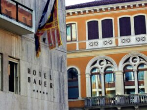 A look at the sign for Rosewood Hotels' historic Hotel Bauer.