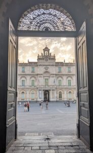 Looking out into a piazza in Catania for a view of one of the oldest universities in Europe in Baroque style.